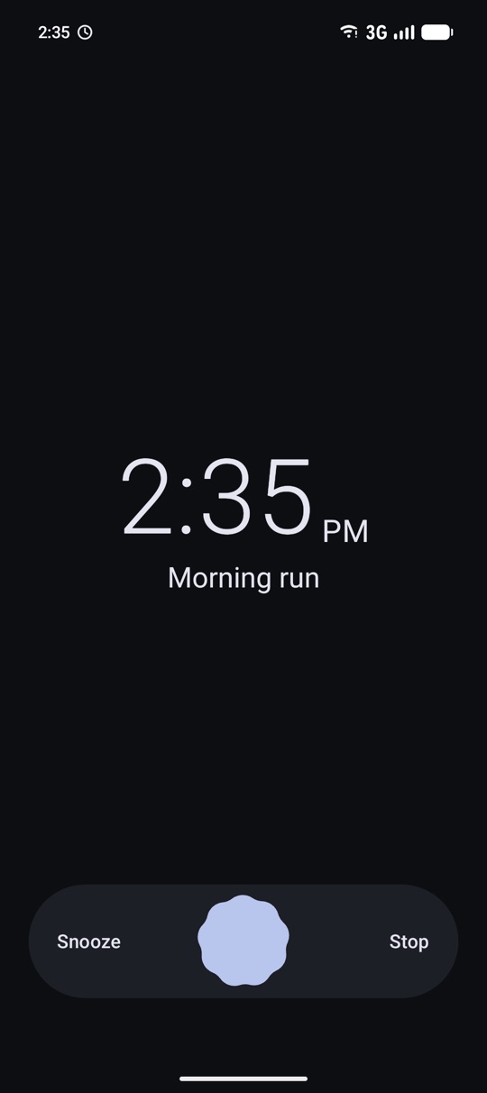 Ringing screen with the time and a swipe control for snooze and stop